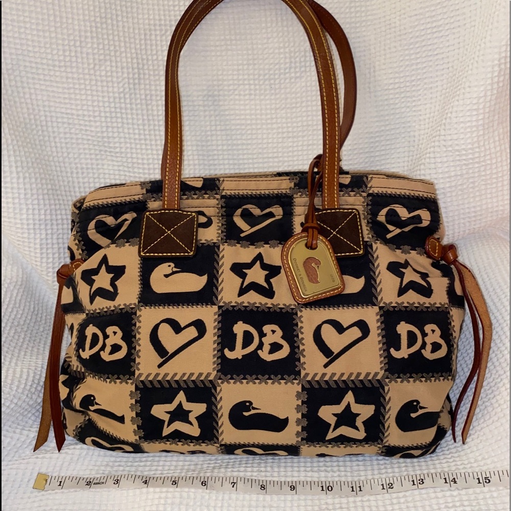 Dooney & Bourke bag. Hot pink lining!!!
